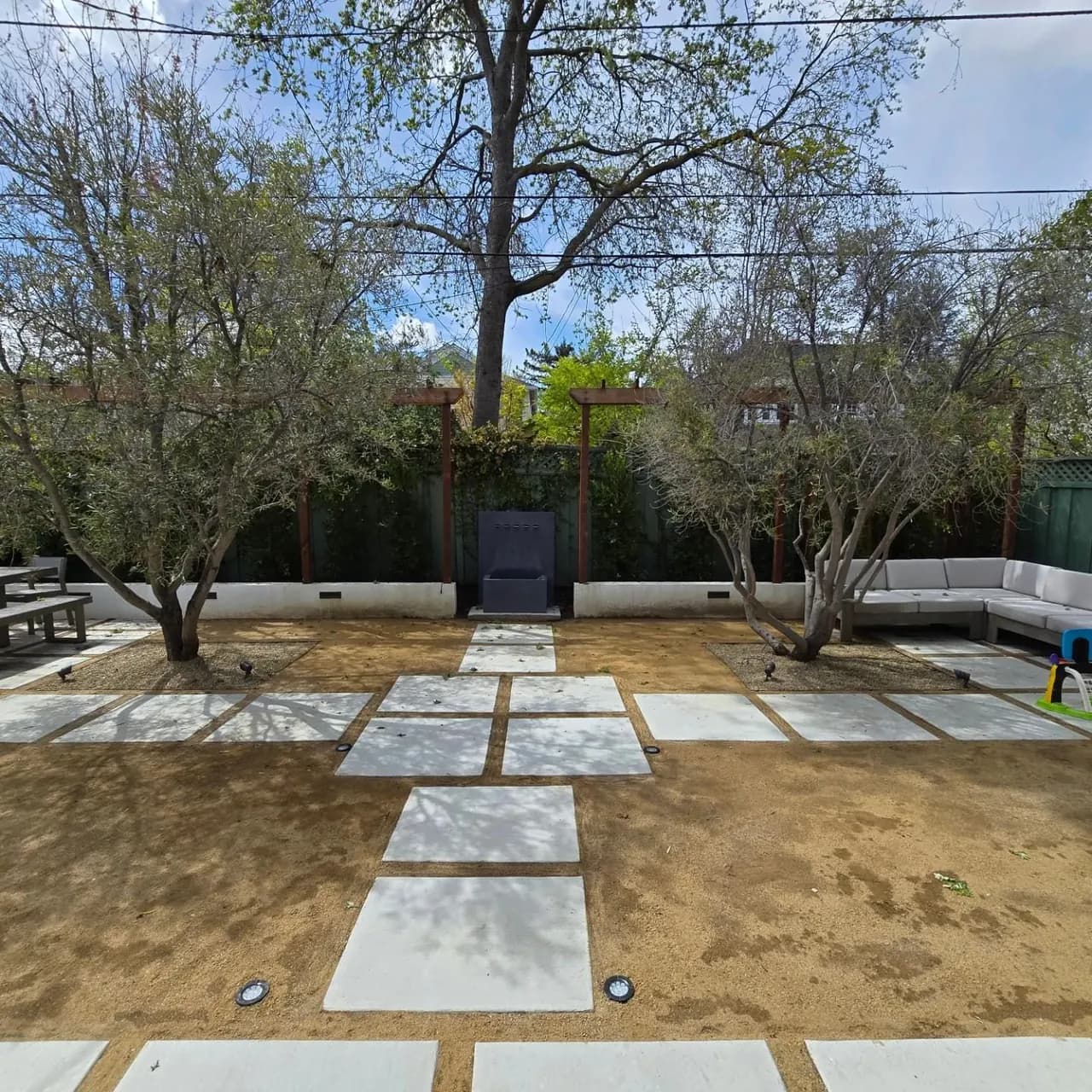 Modern Backyard Renovation Ideas: Concrete Stepping Pads, DG Joints, and a Redwood Privacy Fence