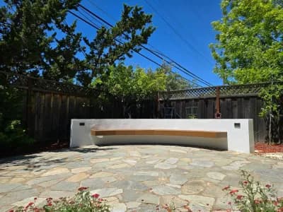Flagstone patio with a floating cantilevered concrete bench